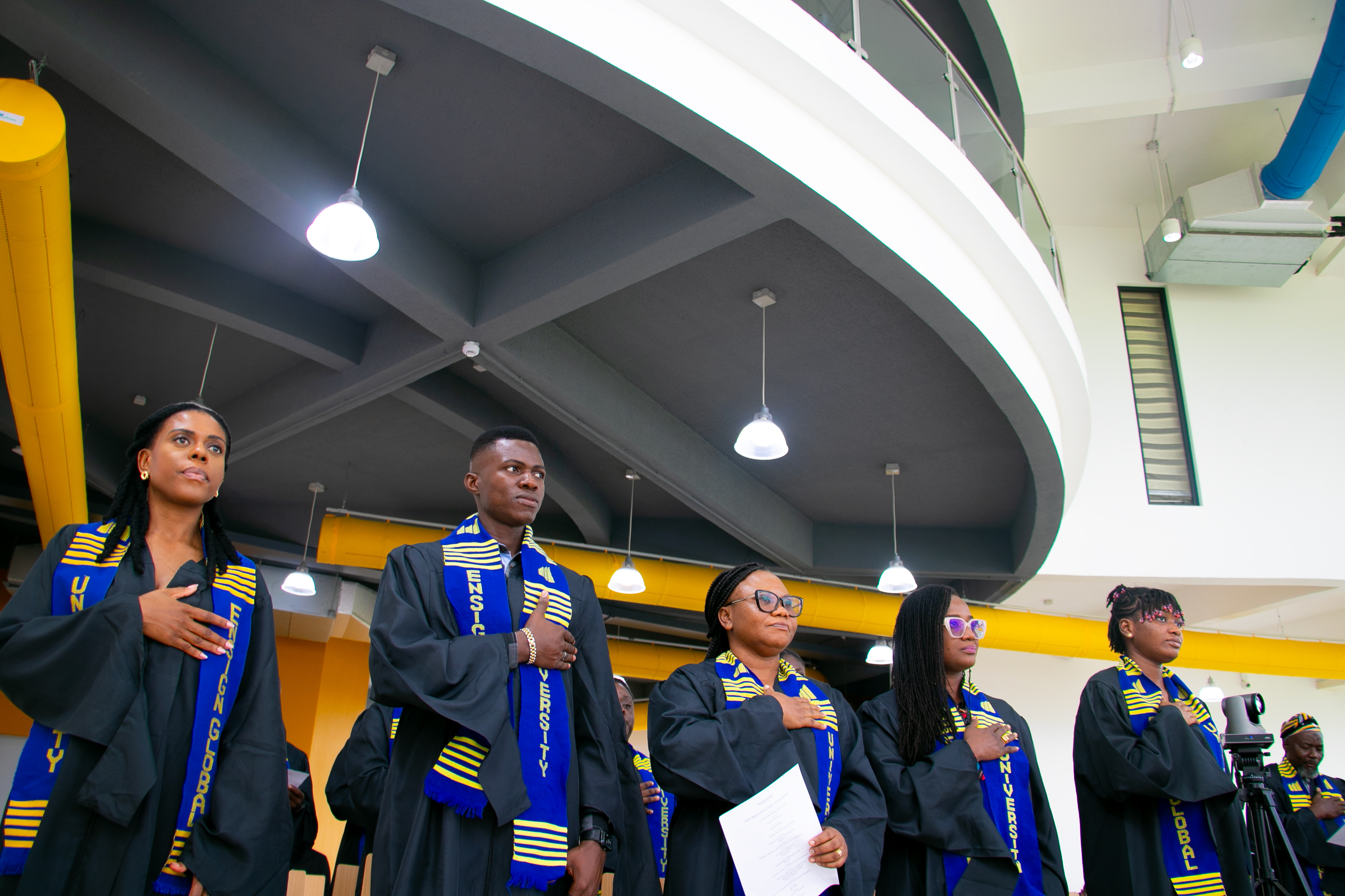 Students stand together reciting the oath of matriculation, marking their formal admission into the Faculty of Community Health.